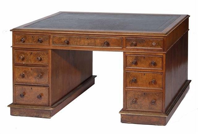 Appraisal: A VICTORIAN FIGURED WALNUT RECTANGULAR PEDESTAL WRITING DESK fitted one