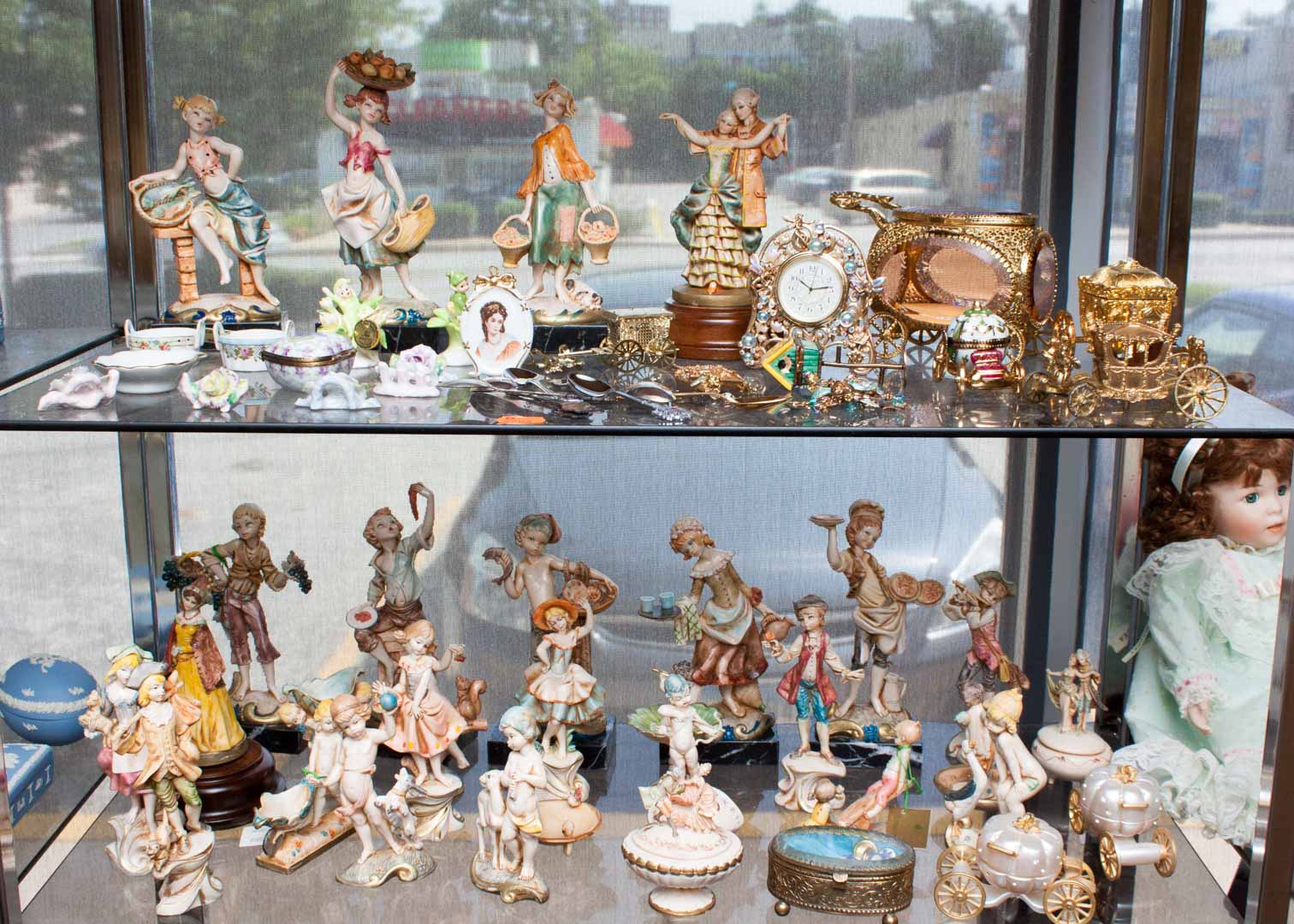 Appraisal: Assortment of decorative items including composition figurines souvenir spoons porcelain