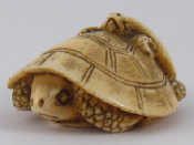 Appraisal: A Japanese ivory netsuke of one tortoise climbing on the