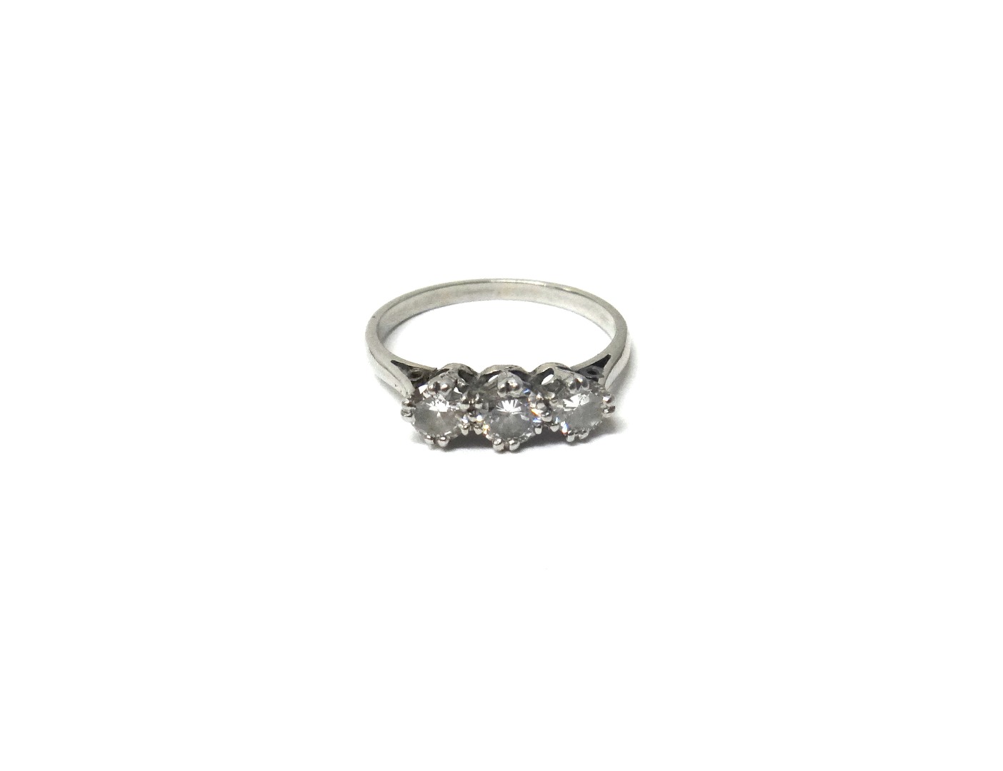 Appraisal: A diamond set three stone ring claw set with a