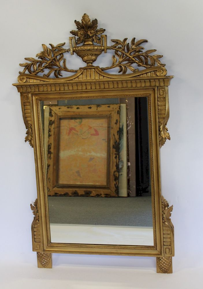 Appraisal: Carved And Giltwood Mirror With Urn Form Crown From a