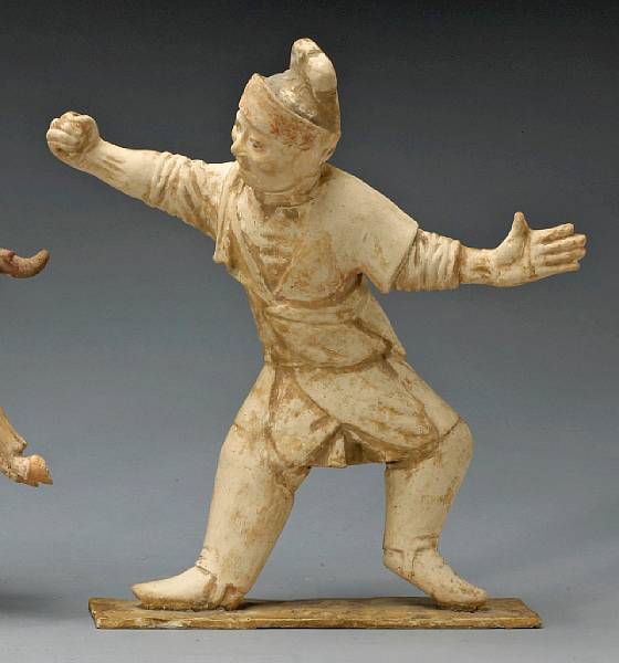 Appraisal: A painted pottery figure of a groom Tang Dynasty Modeled