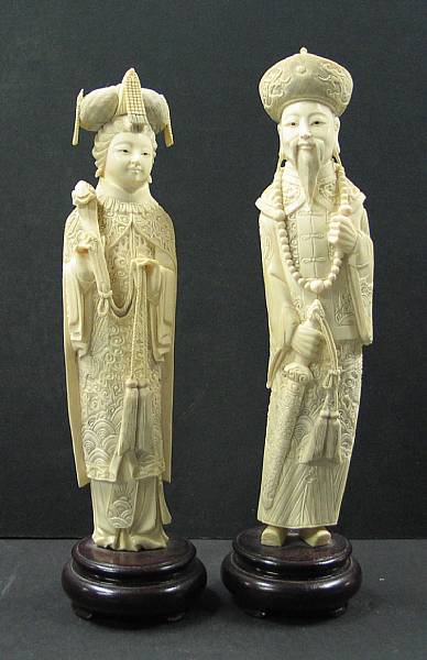 Appraisal: A tinted ivory emperor and empress The emperor dressed in