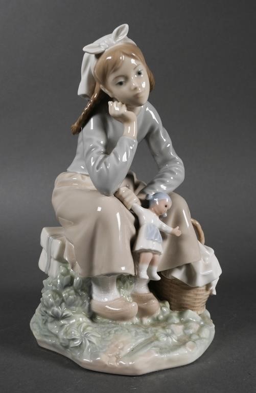 Appraisal: LLADRO FIGURINE GIRL WITH DOLLPorcelain Lladro of a seated girl