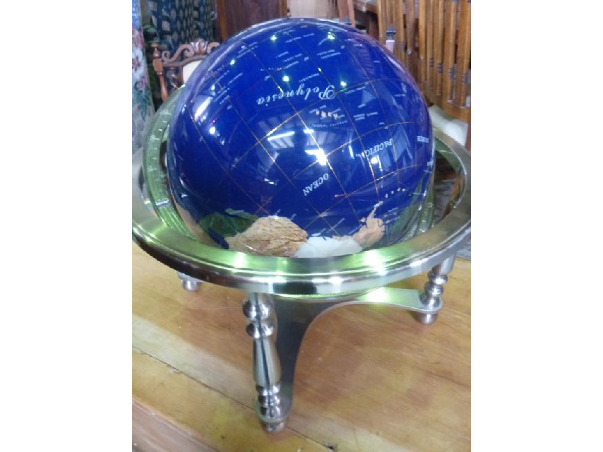 Appraisal: A contemporary Lapis gemstone table top world globe mounted cradled