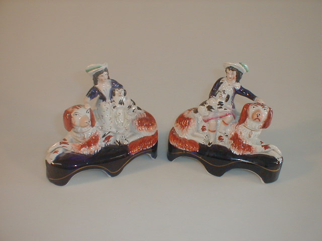 Appraisal: A pair of Victorian Staffordshire pottery figure groups modelled as