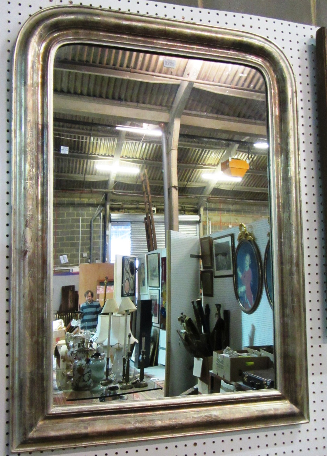 Appraisal: A th century silvered arched top over mantel mirror