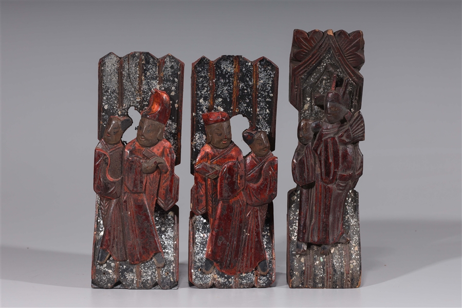 Appraisal: Group of three antique circa Chinese lacquered wood figural carvings