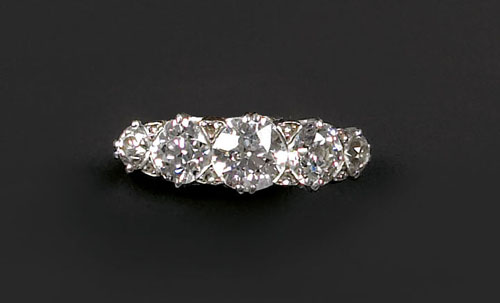 Appraisal: Diamond band with platinum filigree setting containing five in-line old