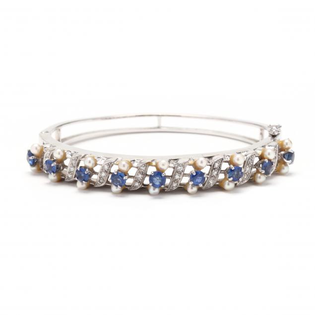 Appraisal: White Gold Sapphire Diamond and Pearl Bangle Bracelet The oval