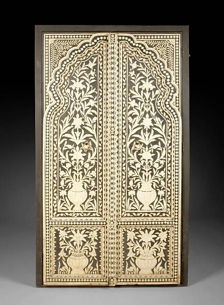 Appraisal: A pair of Anglo Indian painted carved bone paneled doors