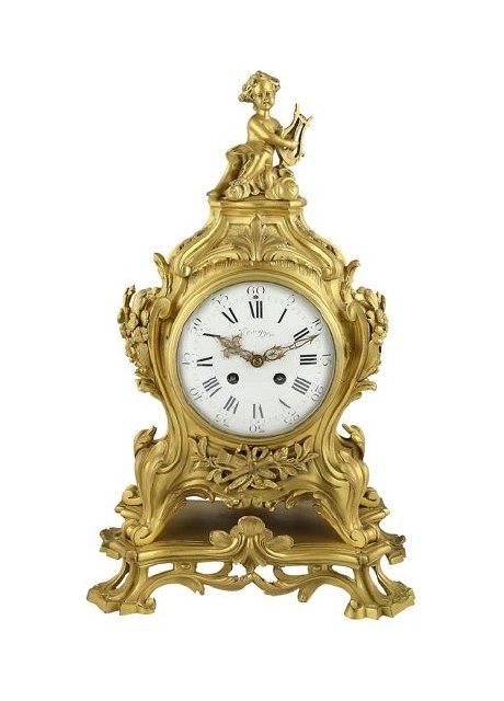 Appraisal: A Louis XV style ormolu striking mantel clock the finial