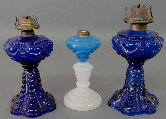 Appraisal: Two similar blue Sandwich glass swag lamp bases h h