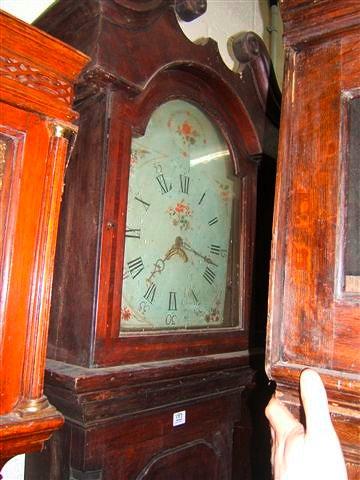 Appraisal: A late Georgian oak hour long case clock the arched