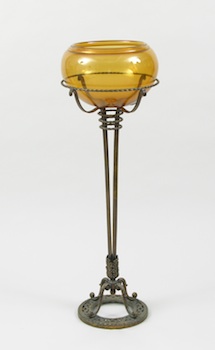 Appraisal: An Amber Glass Fishbowl on a Gilt Metal Stand Attributed