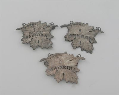 Appraisal: A set of three Victorian vine leaf labels with texturing