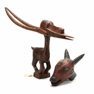 Appraisal: Two West African Horned Animal Wood Carvings the first a