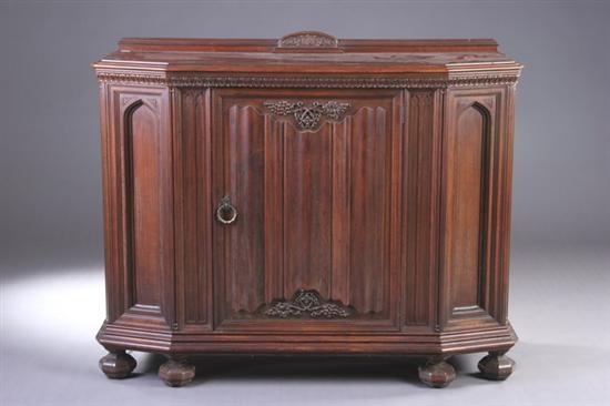 Appraisal: VICTORIAN GOTHIC REVIVAL CABINET th century oak Canted-corner case center