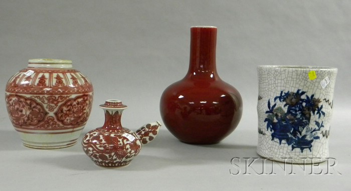 Appraisal: Four Asian Underglaze Ceramic Items a red bottle-form vase a