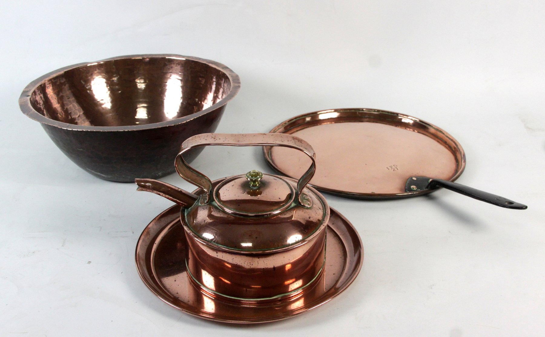 Appraisal: A copper bowl a saucepan cover a kettle and a