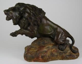 Appraisal: after Antoine-Louis Barye French - bronze lion on plaster base