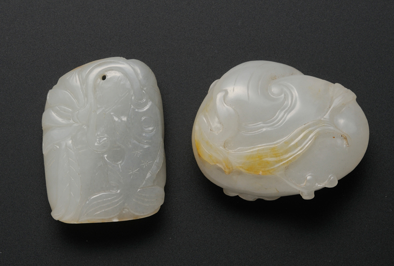 Appraisal: Two Jade Pendants th century gray stone with tan areas