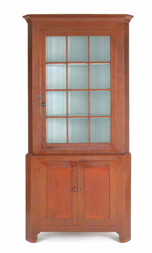 Appraisal: Pennsylvania stained cherry corner cupboard early th c the upper