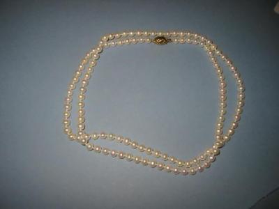 Appraisal: A CULTURED PEARL NECKLACE comprising uniform beads with ct gold