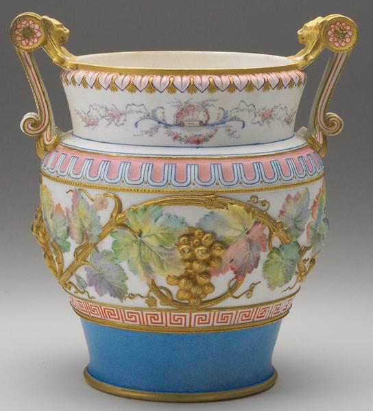 Appraisal: GEORGE JONES Handled bisque urn decorated with grape clusters and