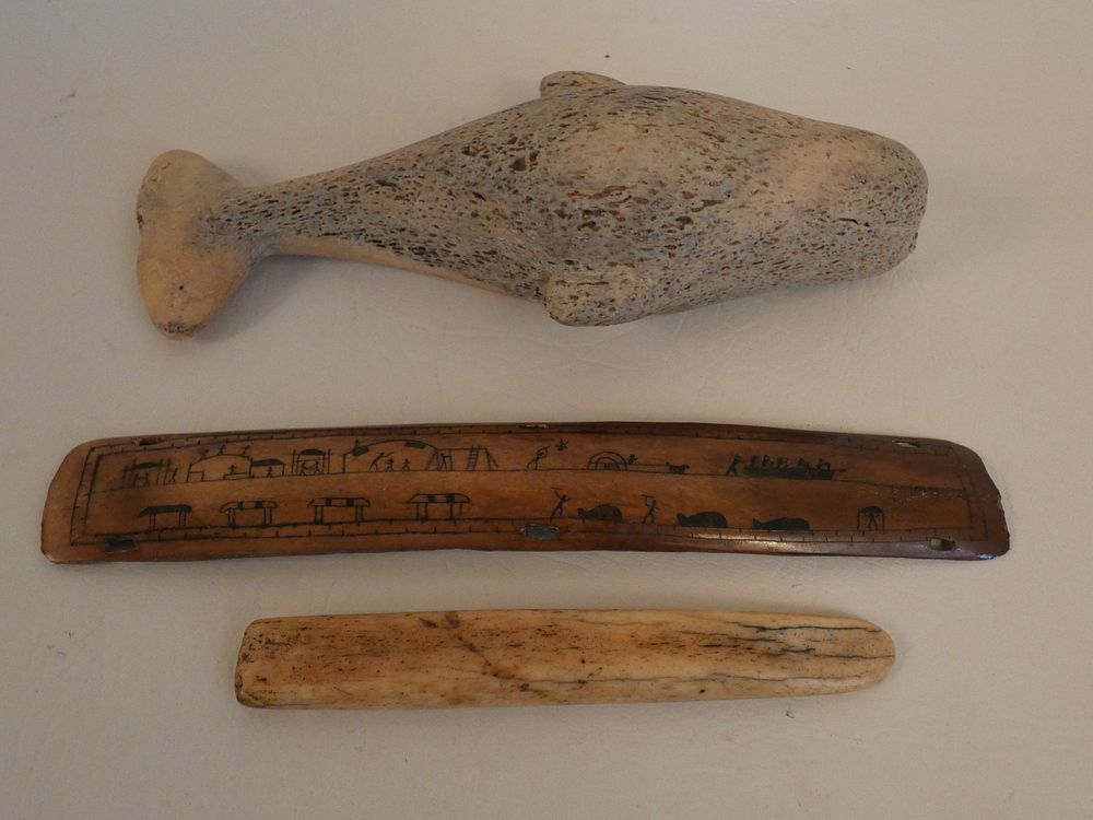 Appraisal: INUIT WHALE BONE ITEMS Inuit whale bone carved items inch