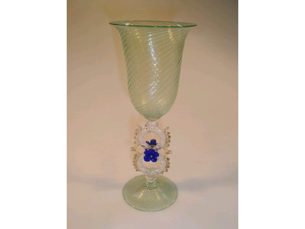 Appraisal: A Venetian glass goblet with a green tinted wrythen moulded