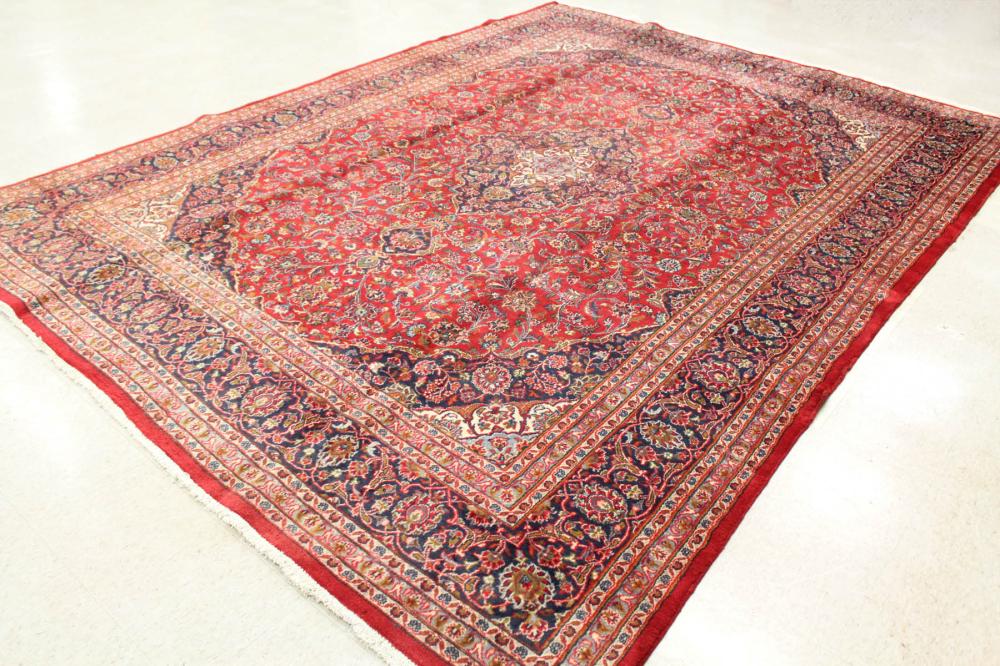 Appraisal: HAND KNOTTED PERSIAN CARPET floral and central floral medallion design