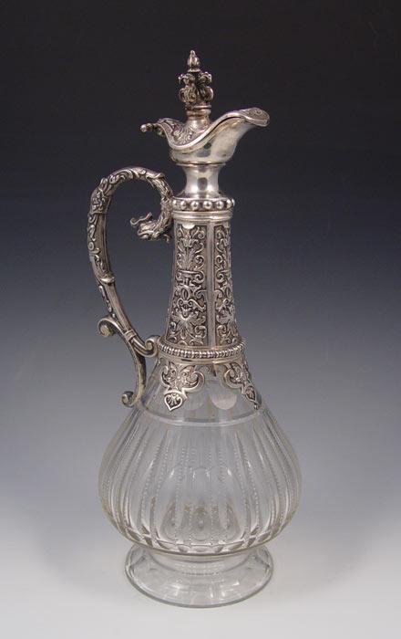 Appraisal: LATE TH C SILVER MOUNTED CLARET JUG Embossed silver handle