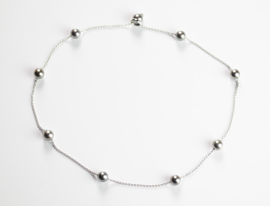 Appraisal: MIKIMOTO BLACK PEARL NECKLACE The k white gold chain measures