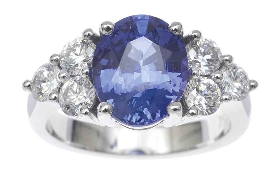 Appraisal: A SAPPHIRE AND DIAMOND RING Centrally set with a fine