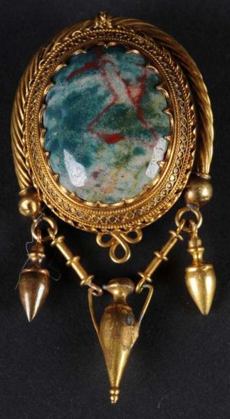 Appraisal: K Gold Pendant Description Multicolored green and burgandy center stone