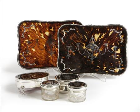 Appraisal: A tortoiseshell and silver inlaid matched dressing table set various