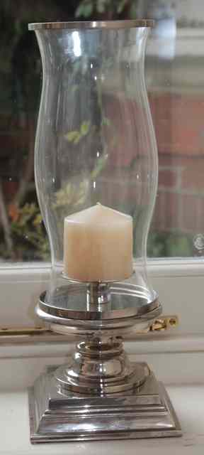 Appraisal: A WHITE METAL CANDLE LANTERN with baluster glass shade and