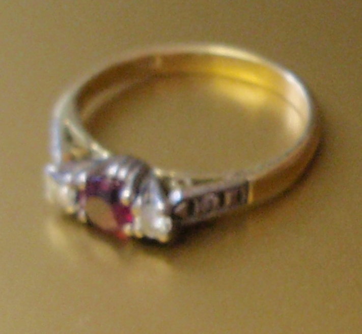 Appraisal: An ct gold ruby and diamond three stone ring