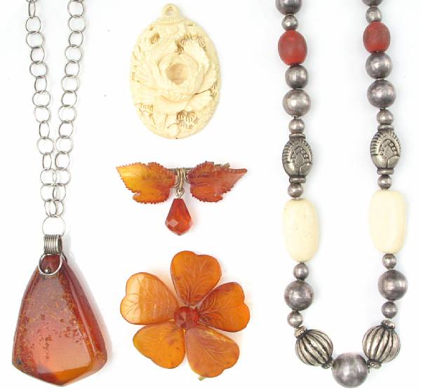 Appraisal: A collection of amber silver and ivory jewelry including three