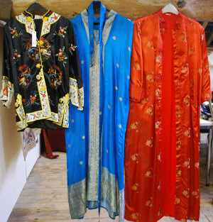 Appraisal: Embroidered black silk Chinese jacket red satin Chinese housecoat and