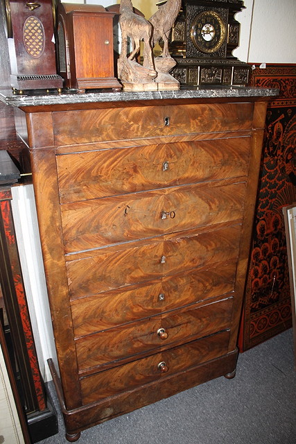 Appraisal: AN EMPIRE MAHOGANY CHEST of seven drawers with marble top