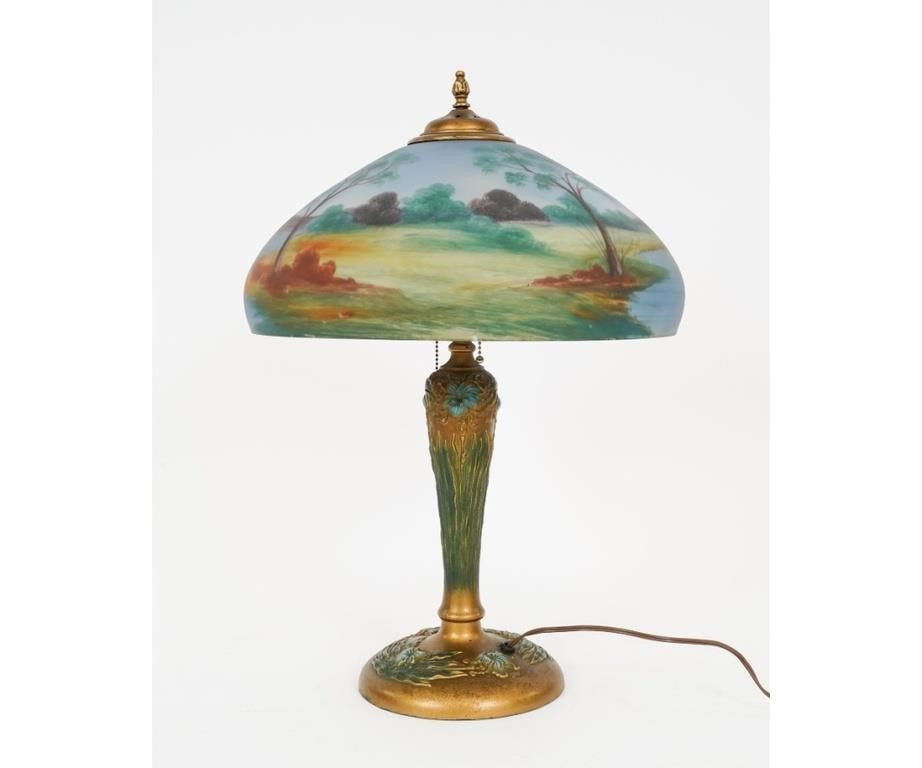 Appraisal: Art Nouveau metal table lamp with reverse painted shade circa