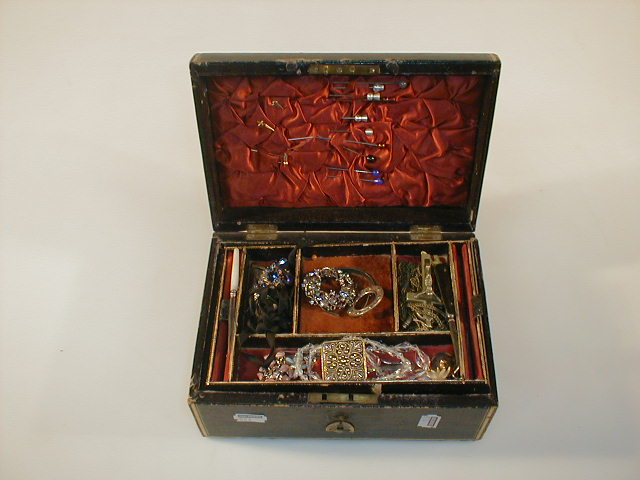 Appraisal: A black leather covered jewel box with gilt decoration brass