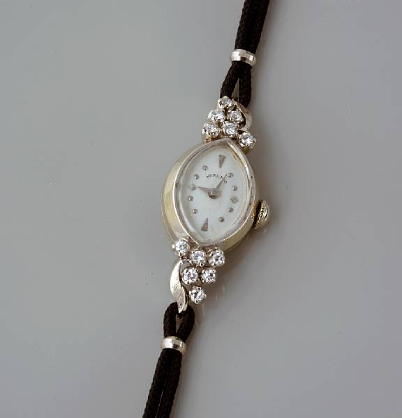 Appraisal: A k white gold and diamond watch with cord strap