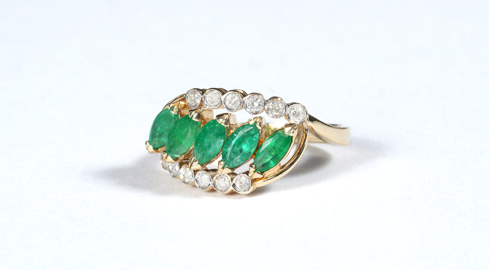 Appraisal: MARQUISE EMERALDS WITH DIAMONDS RING K yellow gold ring features