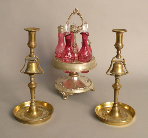 Appraisal: Pair of brass candlesticks h together with a cruet set