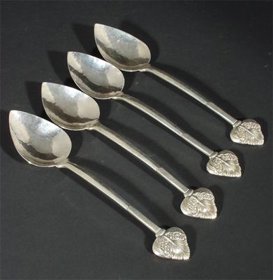 Appraisal: Four Arts and Crafts silver spoons hammered pointed bowls and