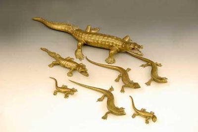 Appraisal: A small collection of Ceylonese brass reptiles each stamped 'V