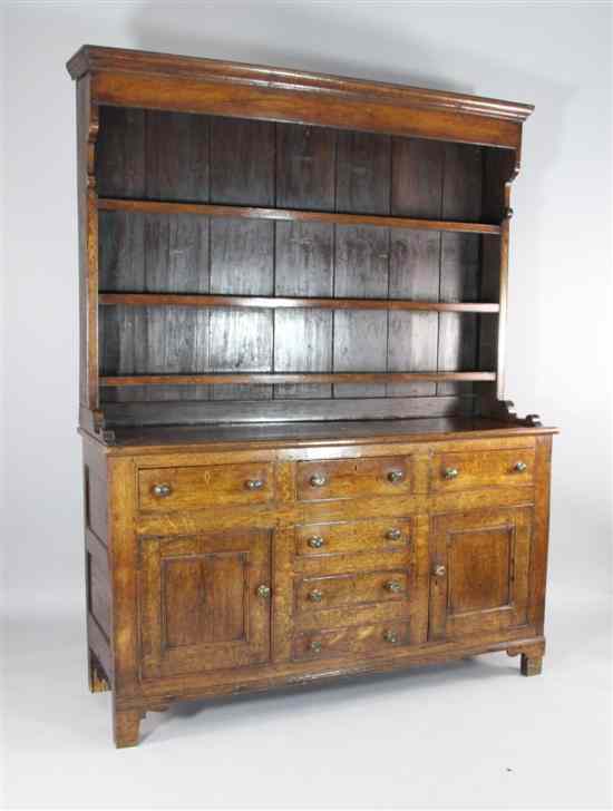 Appraisal: A George III oak dresser with three tier plate rack